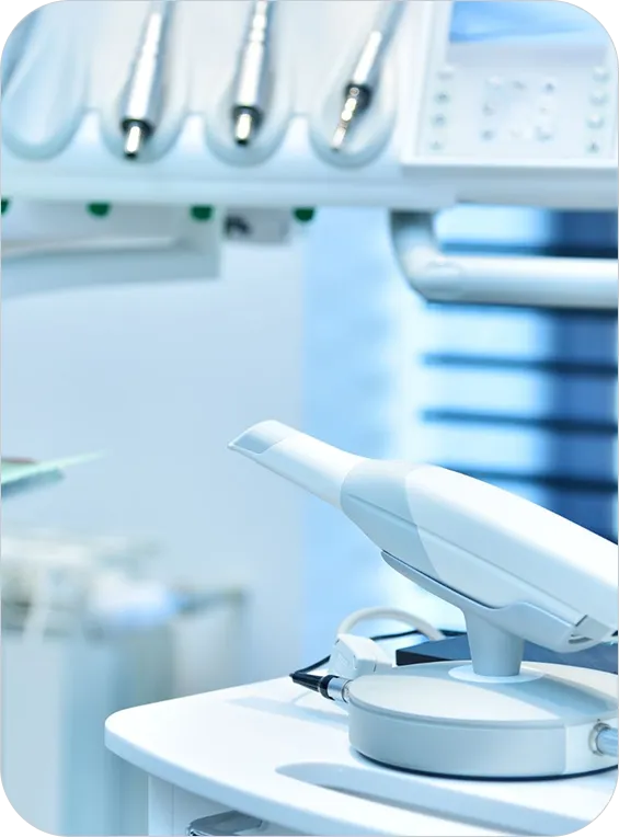 Close-up of a modern dental curing light and dental tools in a clinic.